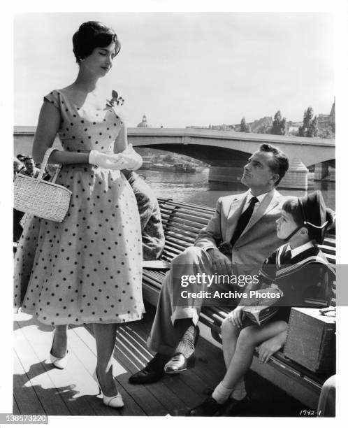 Rossano Brazzi instructs son Martin Stephens to always smile at pretty girls in a scene from the film 'Count Your Blessings', 1958.