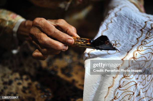batik making - batik indonesia stock pictures, royalty-free photos & images
