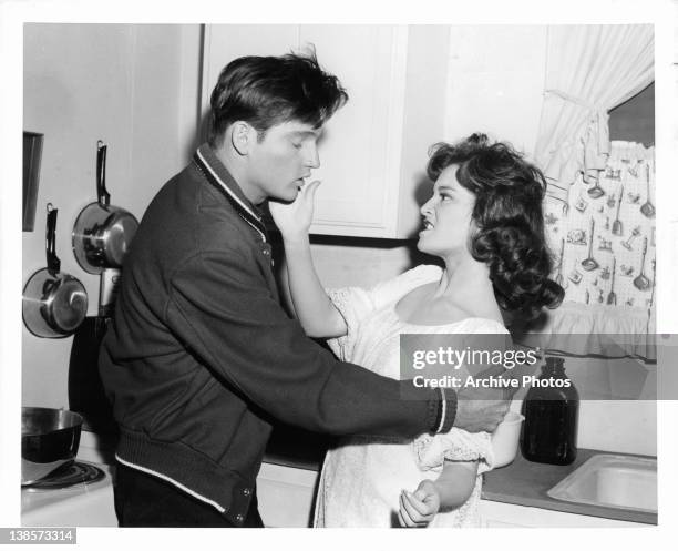 Chris Robinson gets slapped across the face by Anita Sands in a scene from the film 'Diary Of A High School Bride', 1959.