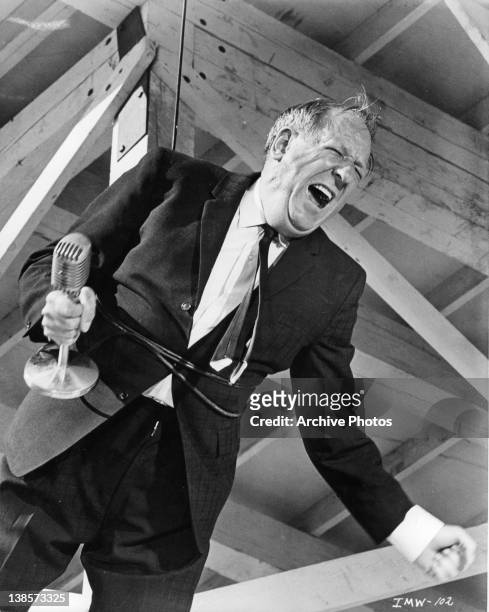 Spencer Tracy tangled in microphone cord in a scene from the film 'It's A Mad Mad Mad Mad World', 1963.