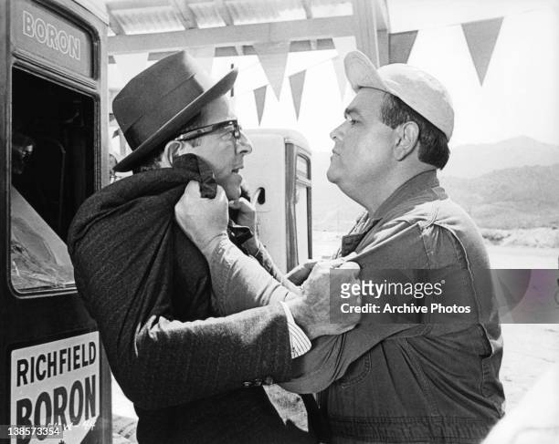 Phil Silvers and Jonathan Winters gripping each other in a scene from the film 'It's A Mad Mad Mad Mad World', 1963.