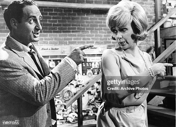 Sid Caesar pointing at Ethel Merman who looks harshly back at him in a scene from the film 'It's A Mad Mad Mad Mad World', 1963.