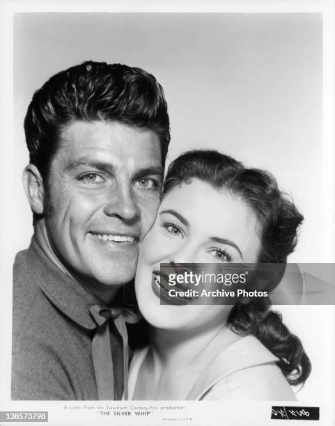 Dale Robertson and Kathleen Crowley embrace in a scene from the film 'The Silver Whip', 1953.