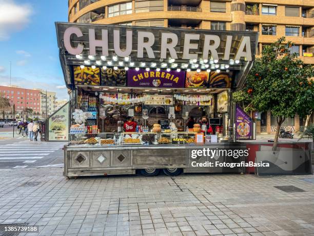 street food stand selling churros - churro stockfoto's en -beelden