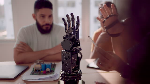 young business man present robot arm in company to customer.