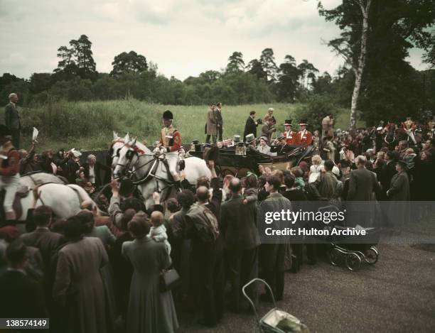 Queen Elizabeth II and Prince Philip, Duke of Edinburgh arriving at Ascot in an open carriage, 1953.