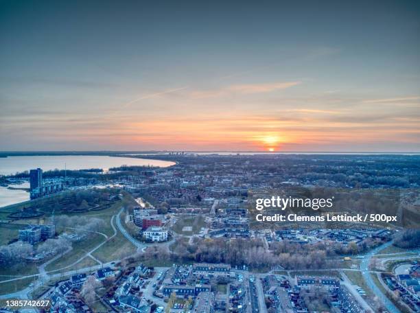 almere haven,high angle view of city against sky during sunset,de meenten,almere,netherlands - flevoland stock pictures, royalty-free photos & images