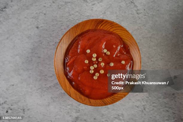 tomato sauce sprinkled with pepper seeds - sauce tomate stock pictures, royalty-free photos & images