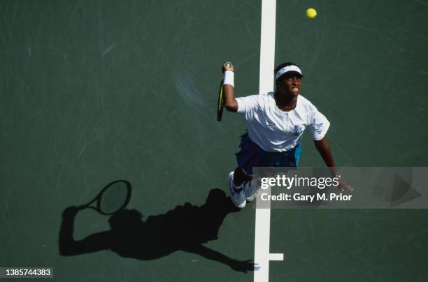 Zina Garrison from the United States keeps her eyes on the tennis ball as she serves to Paola Suarez of Argentina during their Women's Singles Second...