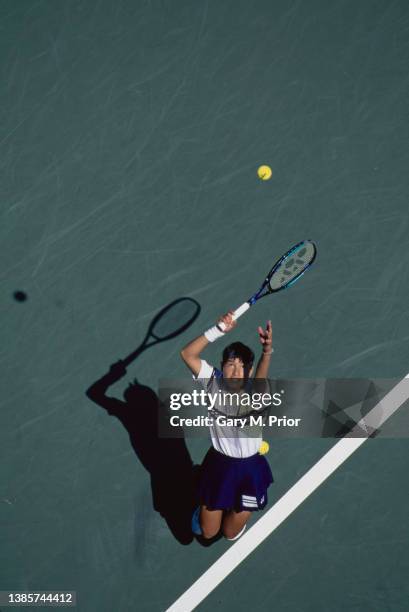 Kimiko Date from Japan keeps her eyes on the tennis ball as she serves to Brenda Schultz-McCarthy of the Netherlands during their Women's Singles...
