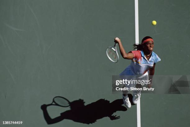 Zina Garrison from the United States keeps her eyes on the tennis ball as she serves to Radka Zrubakova of Slovakia during their Women's Singles...