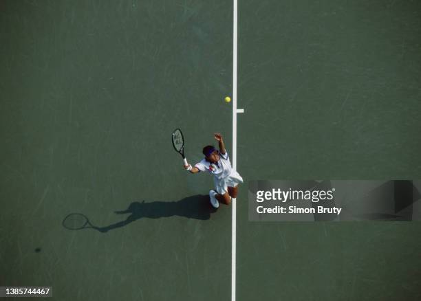 Kimiko Date from Japan keeps her eyes on the tennis ball as she serves to Manuela Maleeva-Fragniere of Switzerland during their Women's Singles...