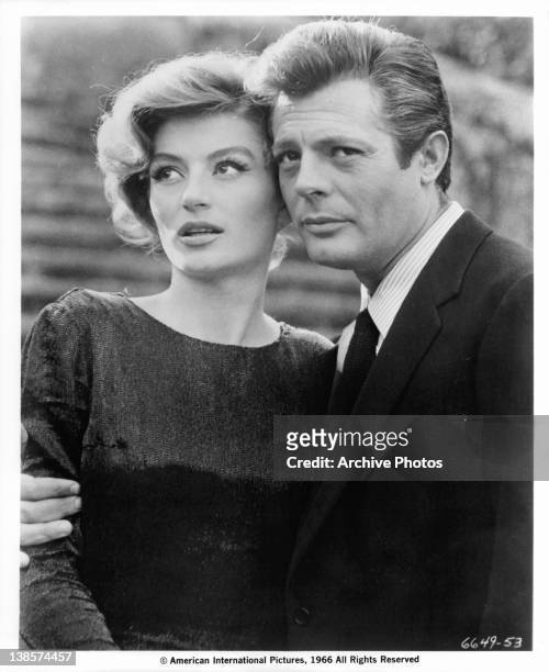 Marcello Mastroianni has his arm around Anouk Aimee in a scene from the film 'La Dolce Vita', 1960.