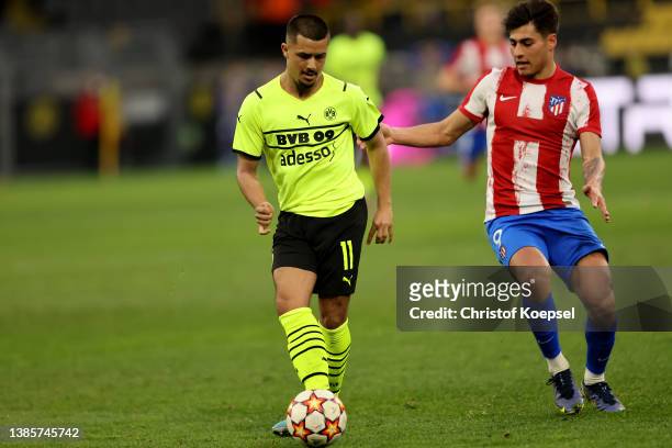 Carlos Martin of Atletico Madrid challenges Lion Semic of Dortmund during the UEFA Youth League quarterfinal match between Borussia Dortmund and...