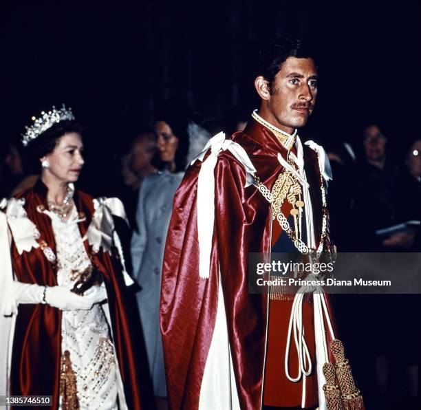 British monarch Queen Elizabeth II escorts her son, Prince Charles, as he is installed as Great Master of the Most Honourable Order of the Bath in...