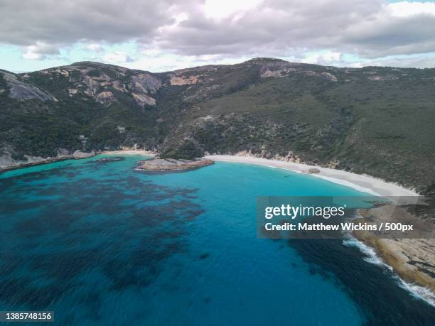 scenic view of sea and mountains against sky,albany,western australia,australia - albany western australia photos et images de collection