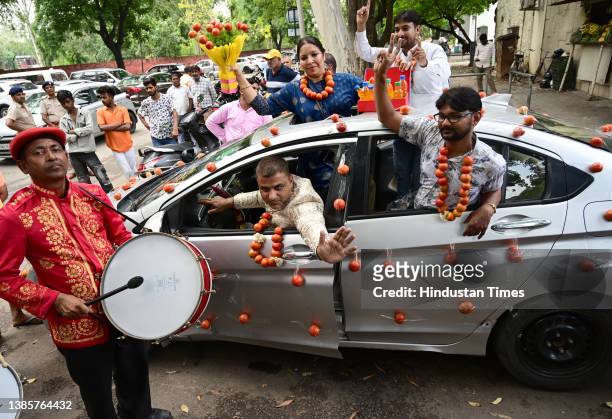 Youth congress workers with Tomato garlands, petrol bottles gift raps and car decoration with Tomato mark protest against Rising Inflation at sector...