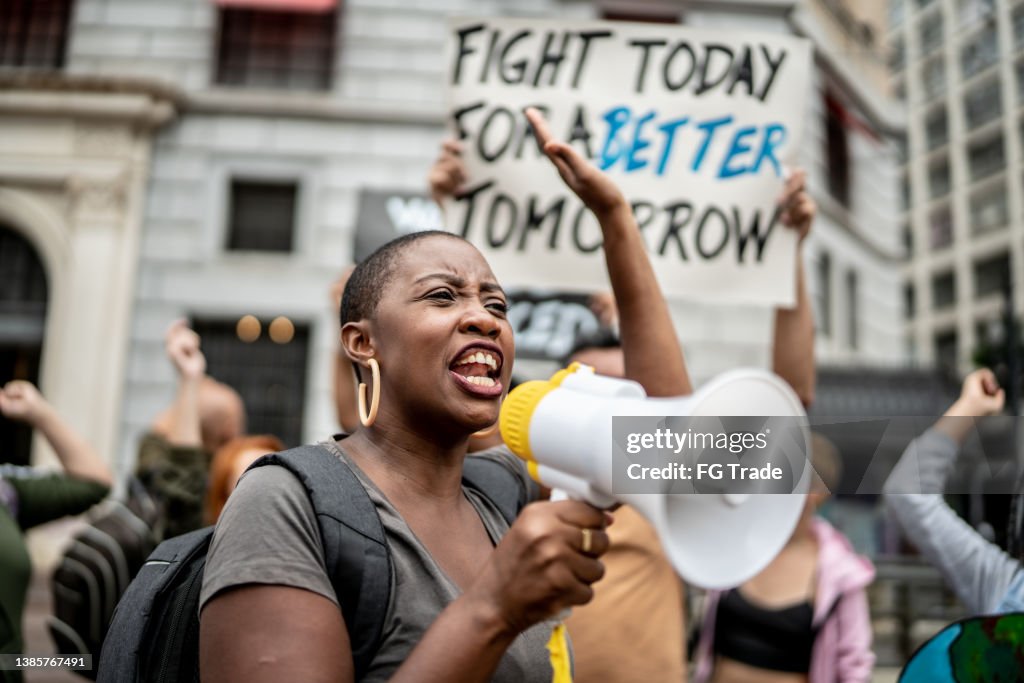 Activists doing a demonstration outdoors