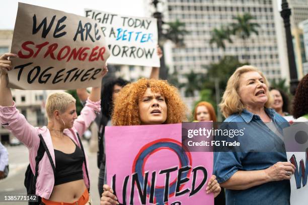 women on a demonstration for equal rights - homophobia stock pictures, royalty-free photos & images