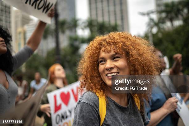 woman on a demonstration for equal rights - female activist stock pictures, royalty-free photos & images