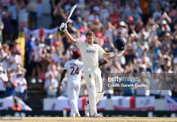 England captain Joe Root celebrates reaching his century during day one of the 2nd test match between West Indies and England at Kensington Oval on...