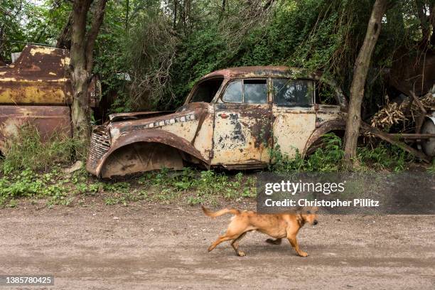 An abandoned vintage unidentified car on February 8, 2022 left at roadside, stripped bare in Capilla del Monte town, Cordoba, Argentina.