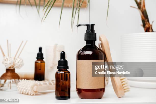 body and face care beauty bath set. bottles shampoo or shower gel  lotion, essential oil, cream, massage brushes and anti-cellulite - herbal medicine stock photos et images de collection