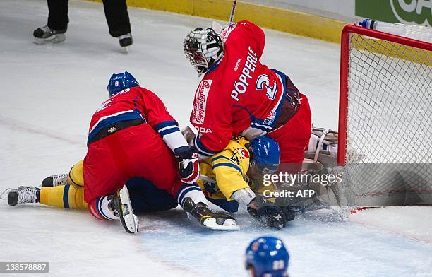Sweden's Andreas Jamtin vies with Czech goalkeeper Tomas Popperlet during the Oddset Hockey games ice hockey match between Sweden and Czech Republic...