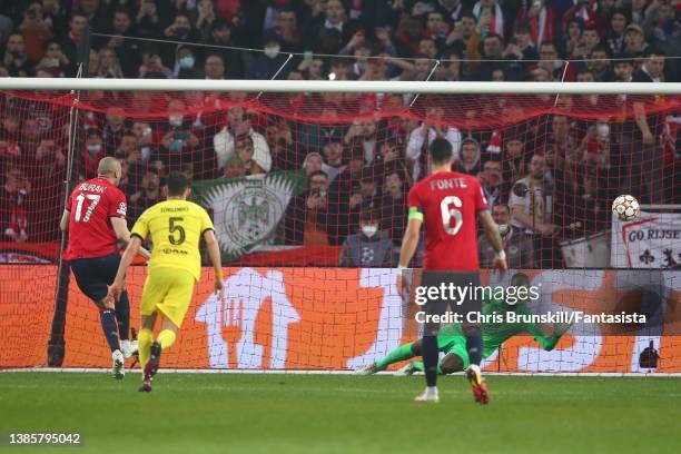 Burak Yilmaz of Lille scores the opening goal from the penalty spot during the UEFA Champions League Round Of Sixteen Leg Two match between Lille OSC...