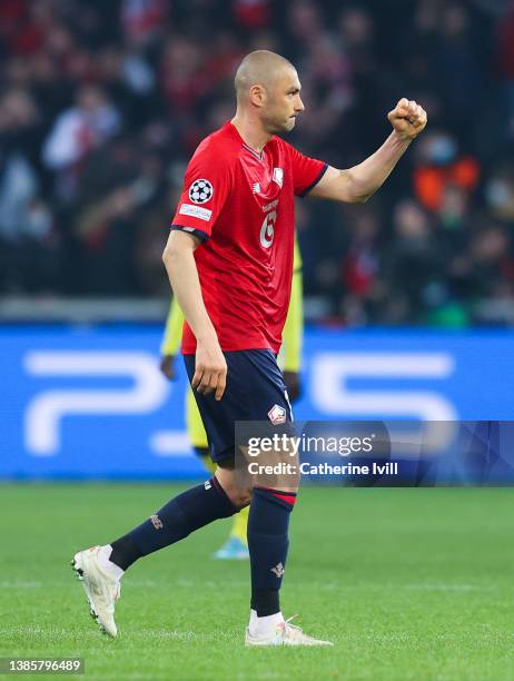 Burak Yilmaz of Lille OSC celebrates their sides first goal during the UEFA Champions League Round Of Sixteen Leg Two match between Lille OSC and...