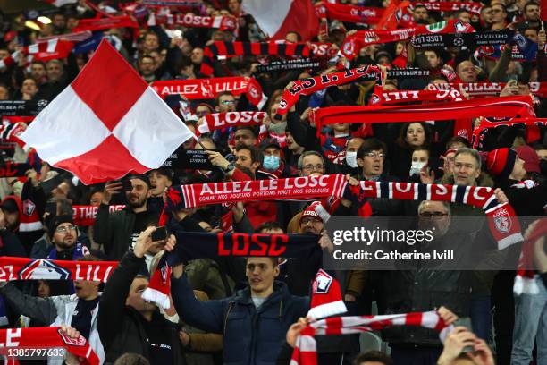 Fans of Lille OSC react in the crowd during the UEFA Champions League Round Of Sixteen Leg Two match between Lille OSC and Chelsea FC at Stade...