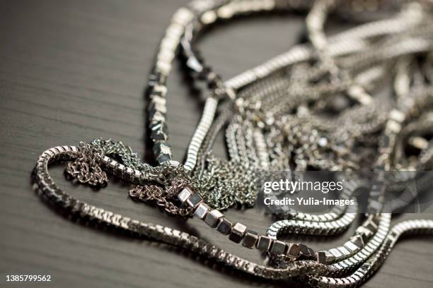 pile of assorted silver chains - necklace stock-fotos und bilder