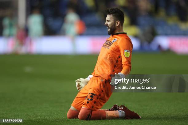 Bartosz Bialkowski of Millwall celebrates their team's second goal during the Sky Bet Championship match between Millwall and Huddersfield Town at...