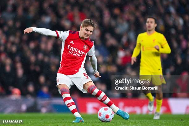 Martin Odegaard of Arsenal shoots towards goal during the Premier League match between Arsenal and Liverpool at Emirates Stadium on March 16, 2022 in...