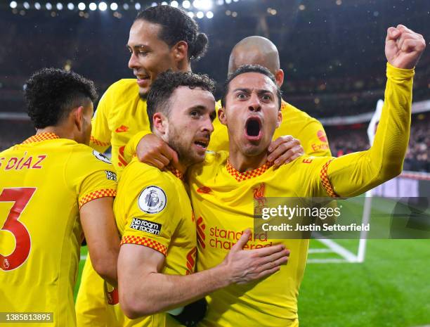 Diogo Jota of Liverpool celebrates their sides first goal with team mate Thiago Alcantara during the Premier League match between Arsenal and...