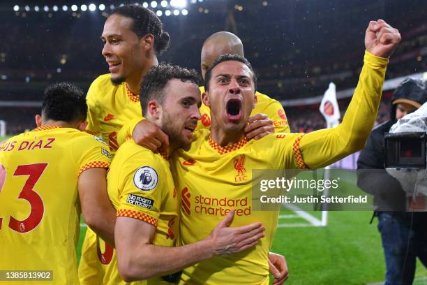 Diogo Jota of Liverpool celebrates their sides first goal with team mate Thiago Alcantara during the Premier League match between Arsenal and...