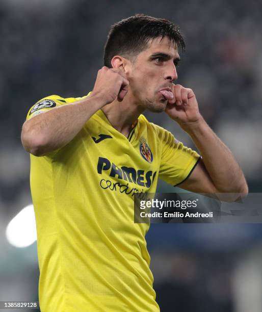 Gerard Moreno of Villarreal CF celebrates after scoring the opening goal during the UEFA Champions League Round Of Sixteen Leg Two match between...
