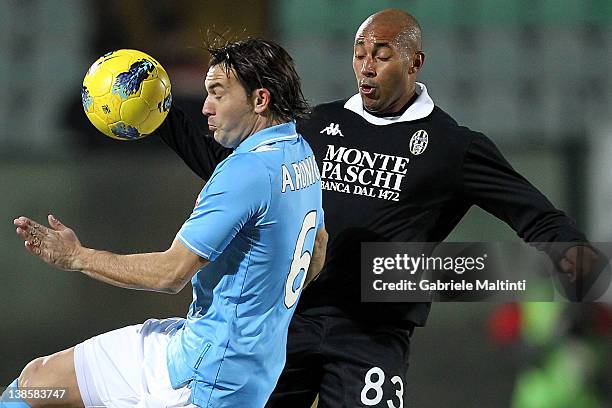 Ferraira Da Silva Reginaldo of AC Siena fights for the ball with Salvatore Aronica of SSC Napoli during the Tim Cup match between AC Siena and SSC...