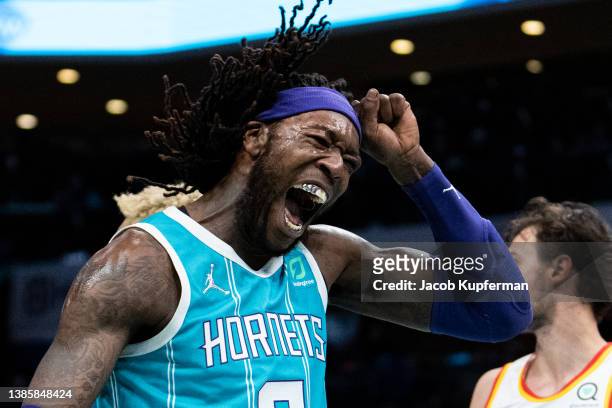 Montrezl Harrell of the Charlotte Hornets reacts after dunking the ball against the Atlanta Hawks in the second quarter during their game at Spectrum...