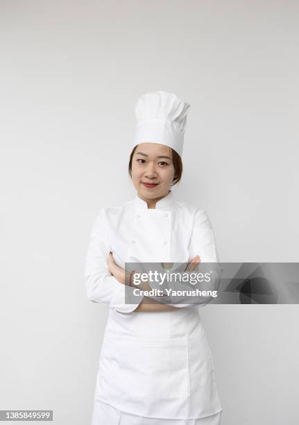 one asian female chef - chef's whites stock-fotos und bilder