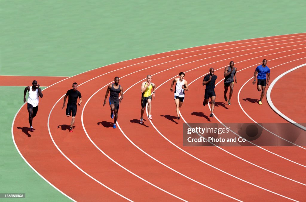 Runners racing on track