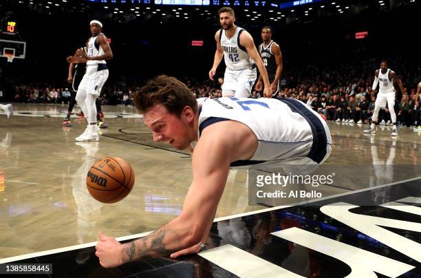 Luka Doncic of the Dallas Mavericks dives for the ball against the Brooklyn Nets during their game at Barclays Center on March 16, 2022 in New York...