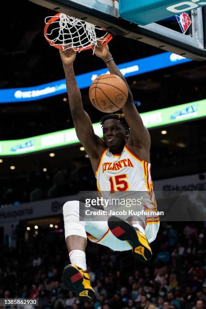 Clint Capela of the Atlanta Hawks dunks the ball against the Charlotte Hornets in the third quarter during their game at Spectrum Center on March 16,...
