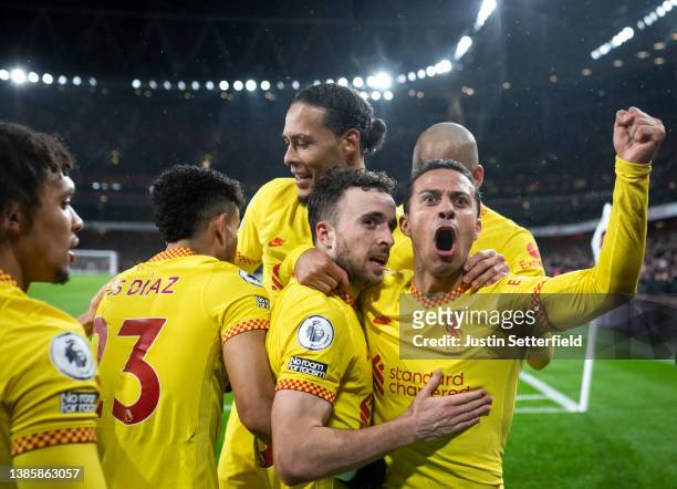 Diogo Jota of Liverpool celebrates their sides first goal with team mate Thiago Alcantara during the Premier League match between Arsenal and...