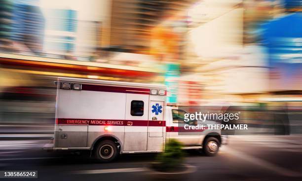 ambulance speeding in manhattan, new york - ambulance imagens e fotografias de stock