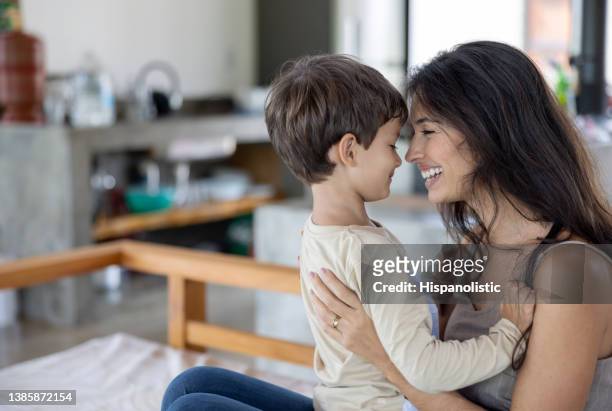 loving mother playing with her son at home - mothers day stock pictures, royalty-free photos & images