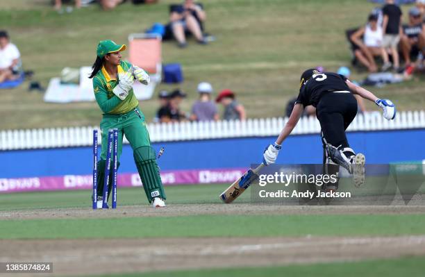 Trisha Chetty of South Africa appeals as Maddy Green of New Zealand is runout during the 2022 ICC Women's Cricket World Cup match between New Zealand...