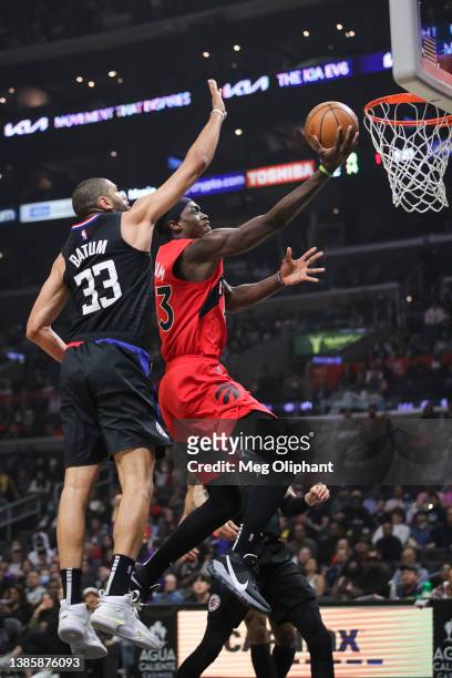 Pascal Siakam of the Toronto Raptors shoots defended by Nicolas Batum of the LA Clippers in the first half at Crypto.com Arena on March 16, 2022 in...