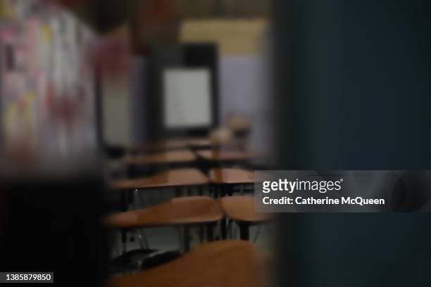 partial view of classroom through side door window pane with heart stickers on glass - assault stock pictures, royalty-free photos & images