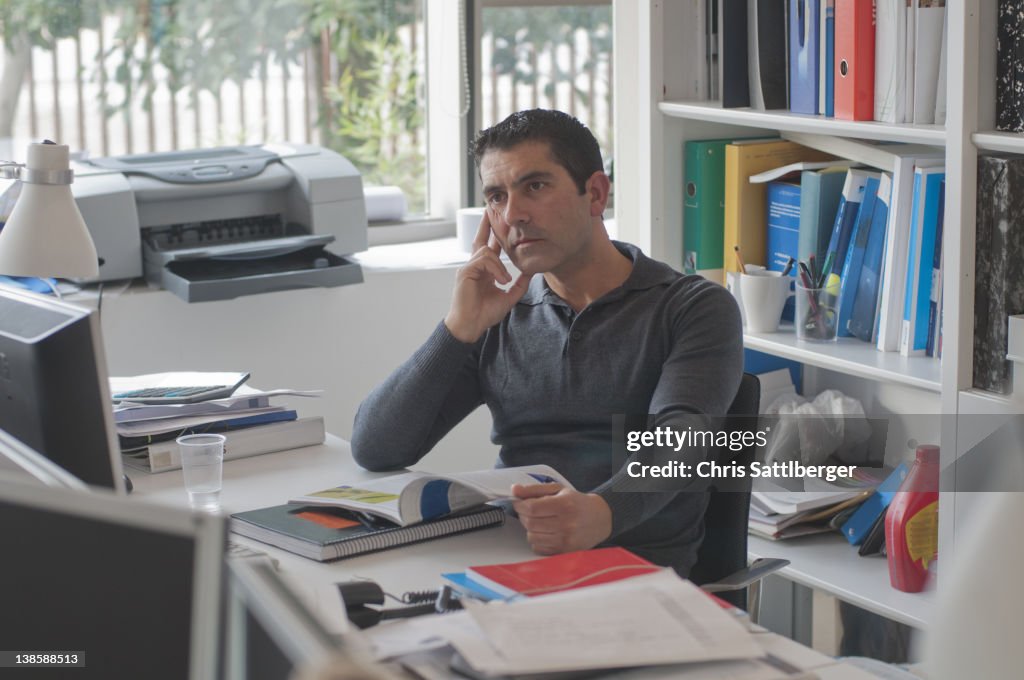 Tired office worker staring at computer screen